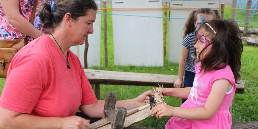 little girl carving wood.JPG