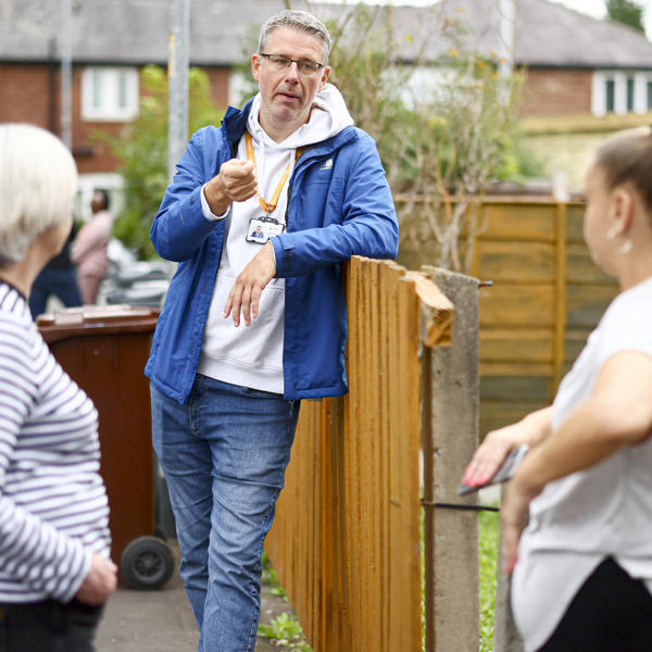 An image of staff and customers on an estate walkabout